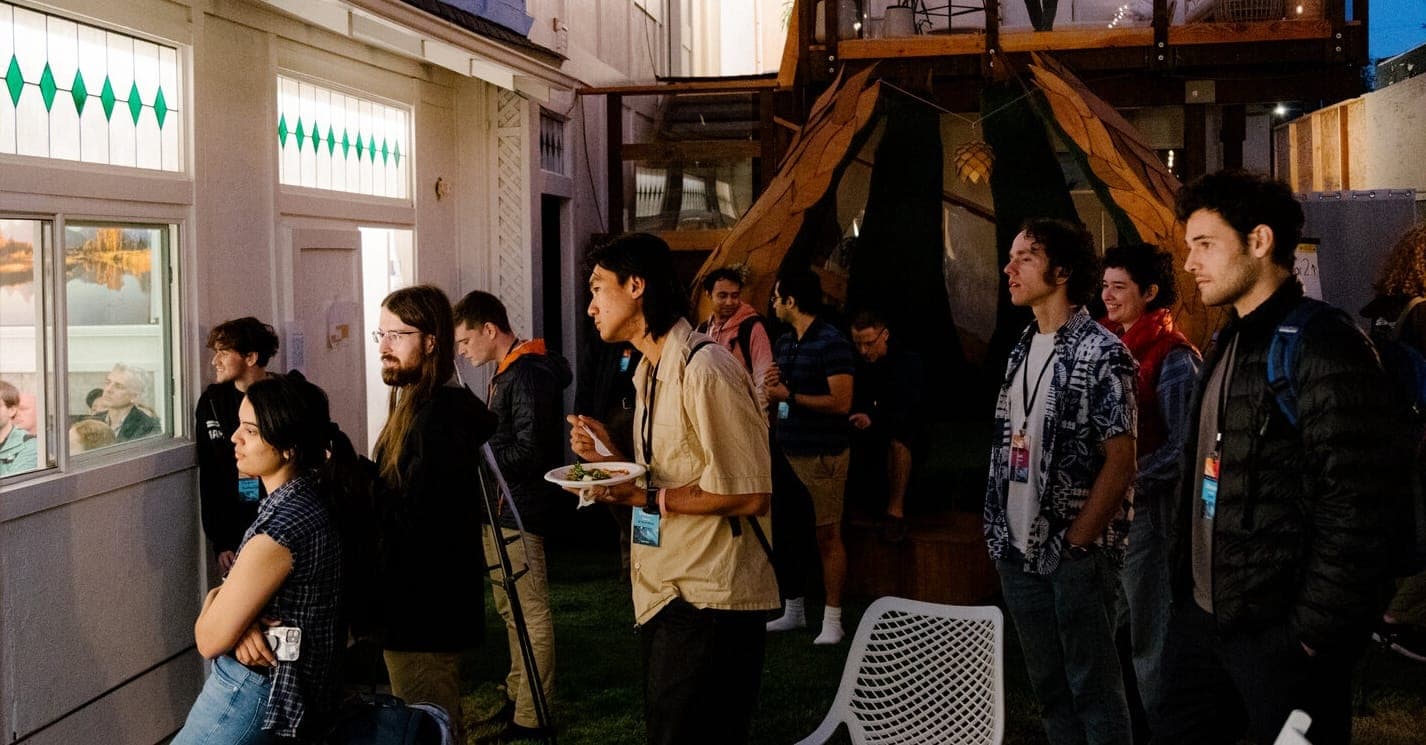 Attendees in conversation at Manifest